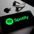 Spotify logo phone Macbook credit Beata Zawrzel NurPhoto Getty Images@1400x1050 1068x801