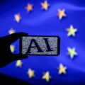 ai logo on smartphone eu flag credit omar marques sopa images lightrocket getty 2000x1500 1068x801